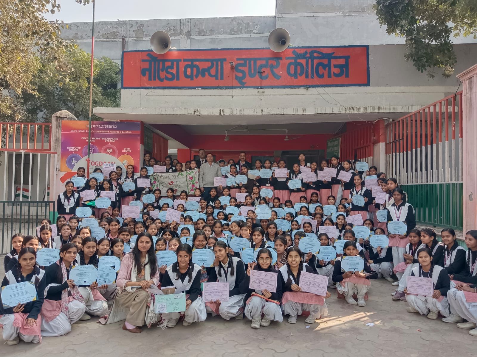 Students of Noida Kanya Inter College holding certificates after an Education Beyond Borders program